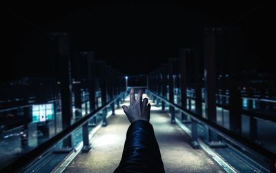 Low section of woman on railroad track at night