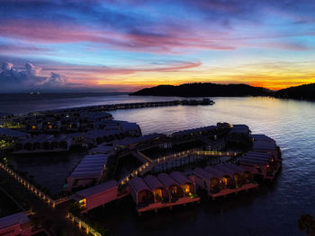 High angle view of sea against sky at sunset