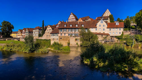 Panorama of the old town of schwaebisch hall with old half-timbered buildings seen from river kocher