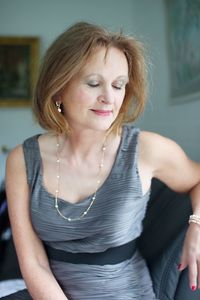 Smiling woman sitting at home