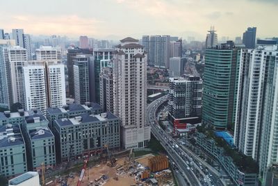 High angle view of modern buildings in city against sky