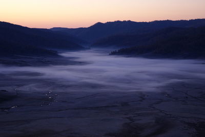Scenic view of mountains at sunset