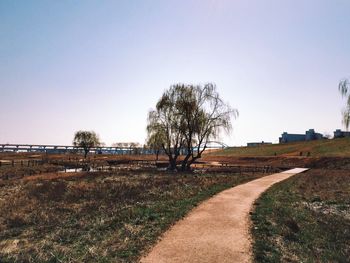 Scenic view of field against cloudy sky