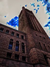 Low angle view of building against blue sky