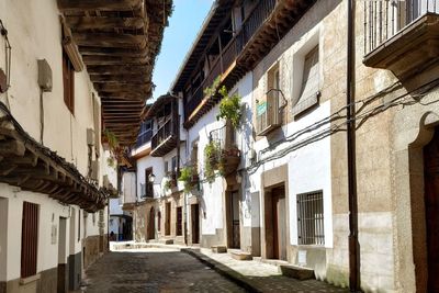 Quiet street amidst buildings in town in small traditional village 