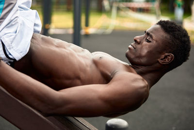 Low section of man exercising in gym