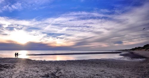 Scenic view of sea against sky at sunset