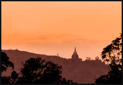 Silhouette of church at sunset