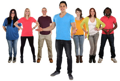 Portrait of smiling young people against white background