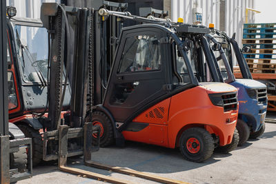 Forklifts parked outside a storage center.