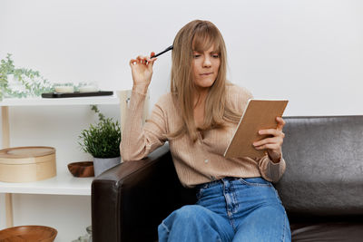 Young woman using mobile phone