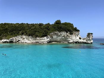 Scenic view of sea against clear blue sky