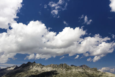 Low angle view of clouds against blue sky