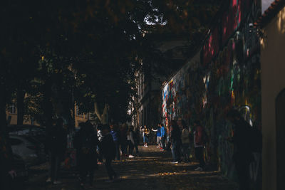 People on footpath at night