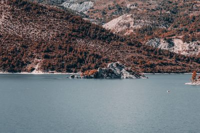 Scenic view of sea against mountain