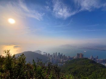 Scenic view of city and buildings against sky