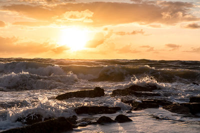 Scenic view of sea against sky during sunset