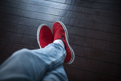 Low section of man wearing shoes