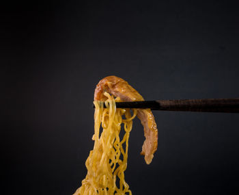 Close-up of bread against black background