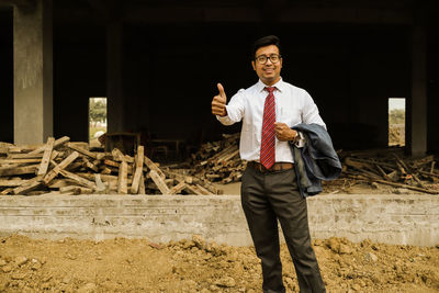 Portrait of a man standing outdoors