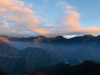 Scenic view of mountains against sky during sunset