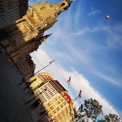 Low angle view of buildings in city against sky