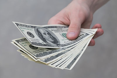 Close-up of hand holding paper