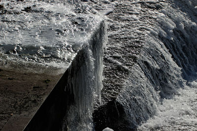 Close-up of sea waves against sky
