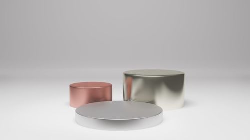 Close-up of empty coffee cup on table against white background