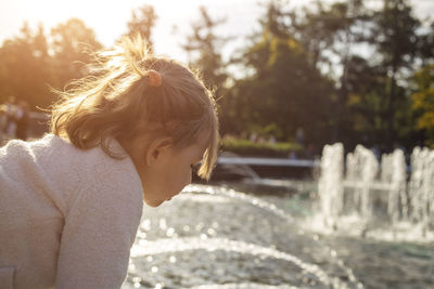 Portrait of boy standing in water