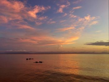 Scenic view of sea at sunset