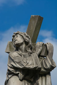 Low angle view of statue against sky