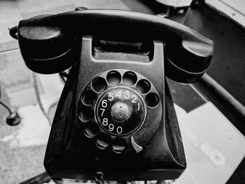 High angle view of old telephone on table