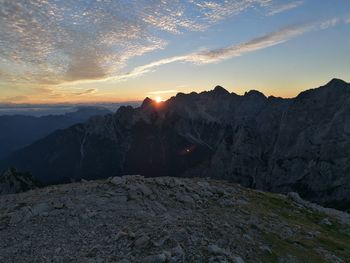 Scenic view of mountains against sky during sunset