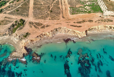 High angle view of woman swimming in sea