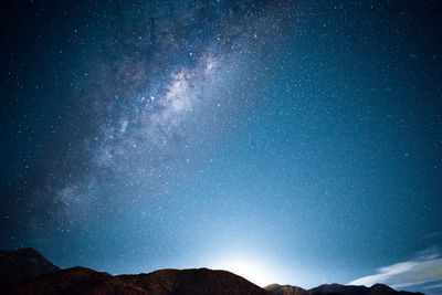 Low angle view of mountain against sky at night