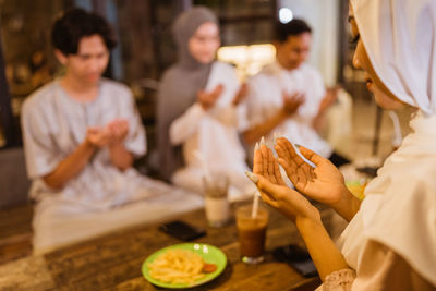 Midsection of woman preparing food on table