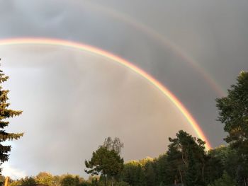 Low angle view of rainbow against sky