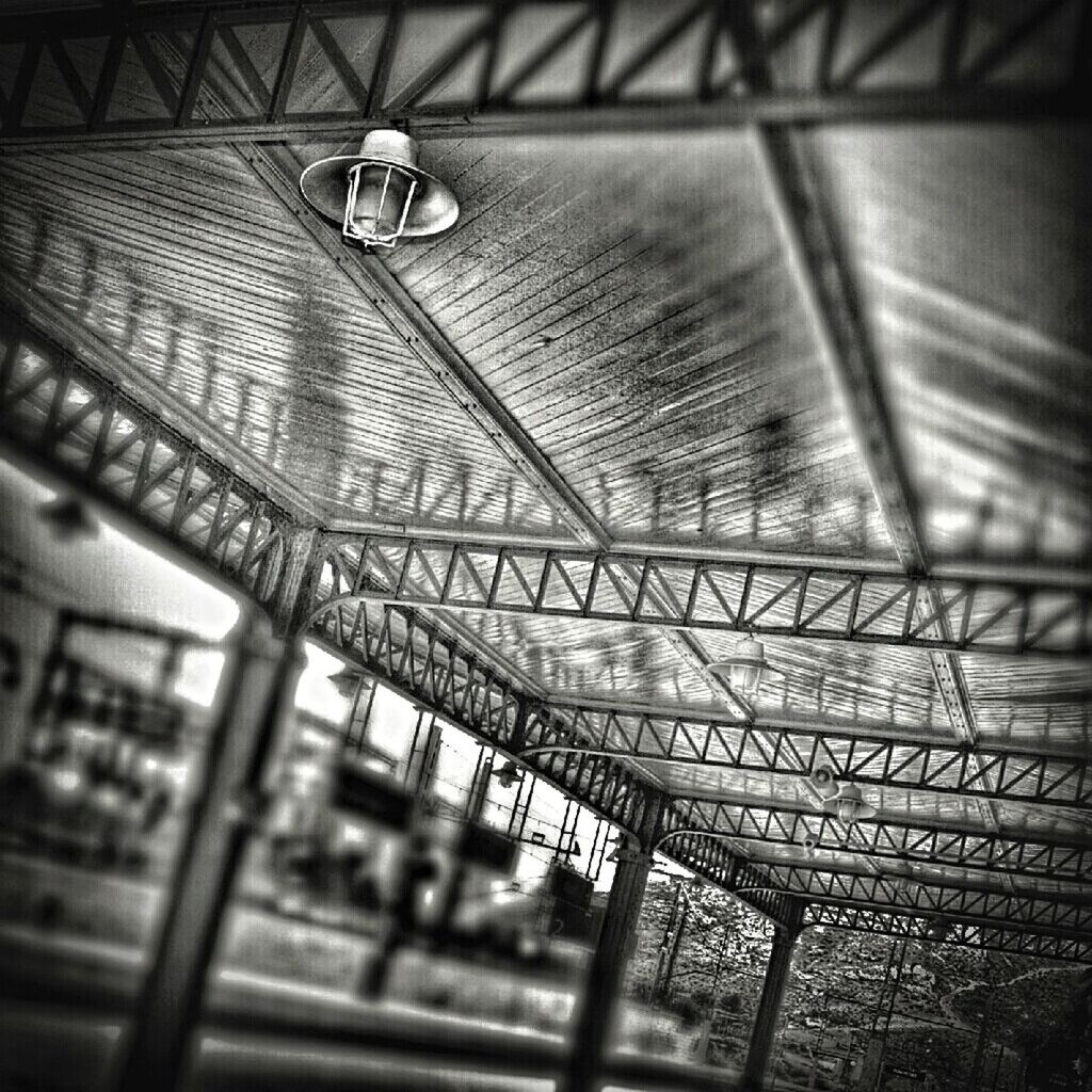 indoors, illuminated, ceiling, lighting equipment, architecture, built structure, low angle view, no people, metal, pattern, absence, night, electric light, interior, electricity, empty, building, window, selective focus