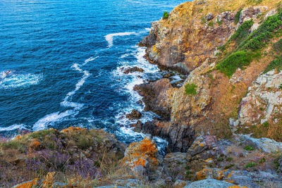 High angle view of rock formation in sea