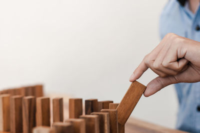 Close-up of man holding wood