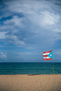 Flag of puerto rico on the beach