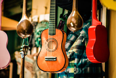Close-up of guitars for sale