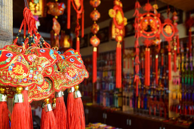 Close-up of red decoration hanging in market stall