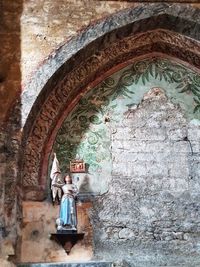 Man seen through archway