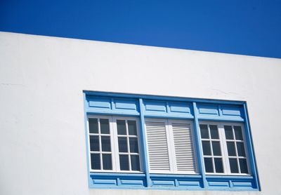 Low angle view of white house against clear sky