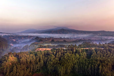 Scenic view of landscape against sky during sunset