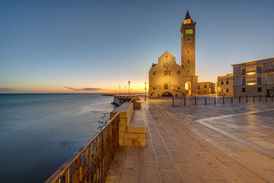The piazza duomo with the famous cathedral in trani before sunrise
