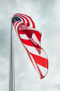 Low angle view of flag against sky