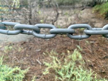 Close-up of chain on field